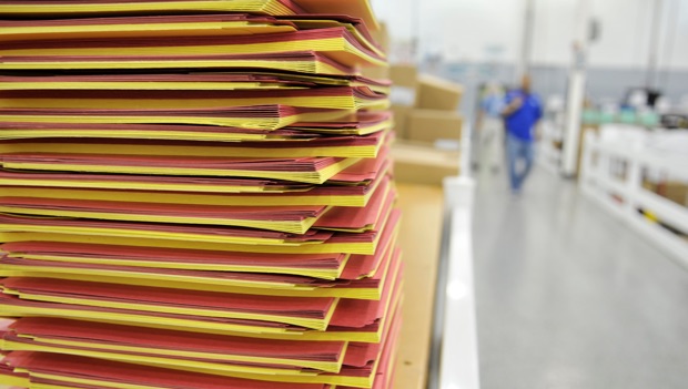 alternating stacks of red and yellow paper