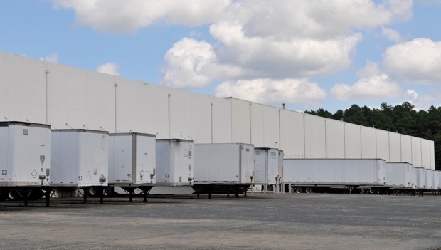 white LCI distribution trucks