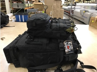 black backpack, filled with medical kitting supplies
